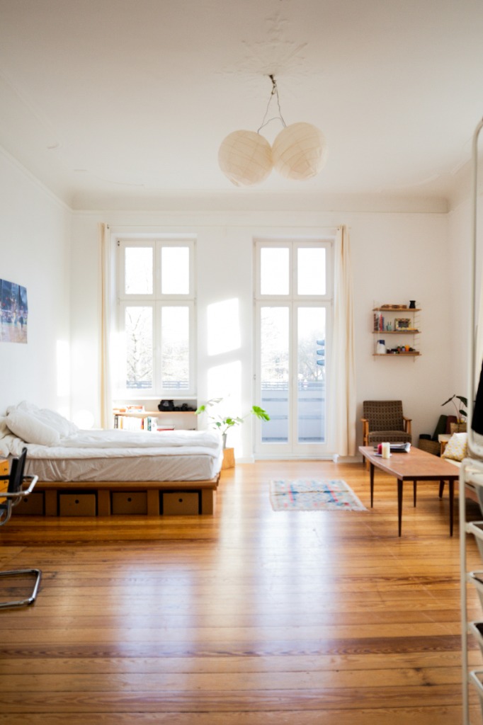 Minimalist bedroom with wooden floors