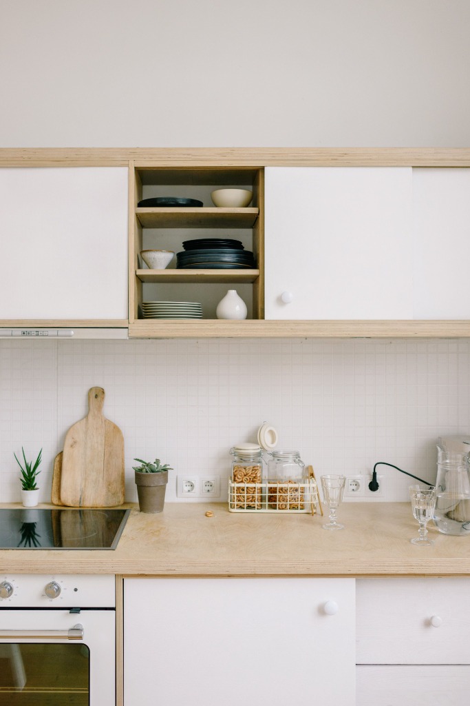 Bright modern kitchen layout with wood accents